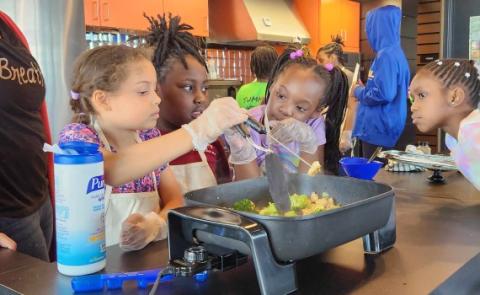 Children cooking during the camp.