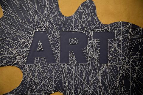 Image of strings across the canvas except for in the middle where the word "Art" is spelled out