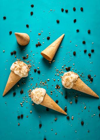 5 ice cream cones spilled across a blue background