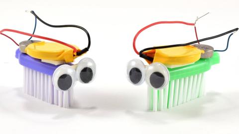 photo of two bristlebots (toothbrush robots)