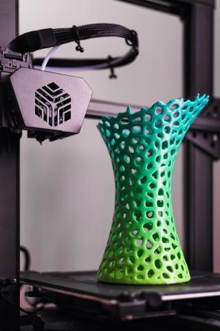 3D printed object sits on a 3D printer