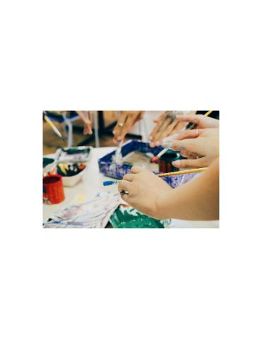 People holding paint burshes.