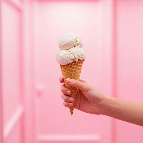 Vanilla Ice Cream in Waffle Cone With Pink Room Background