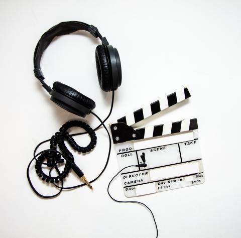 Headphones and clapboard for filmmaking