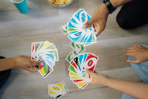 people playing uno showing their cards