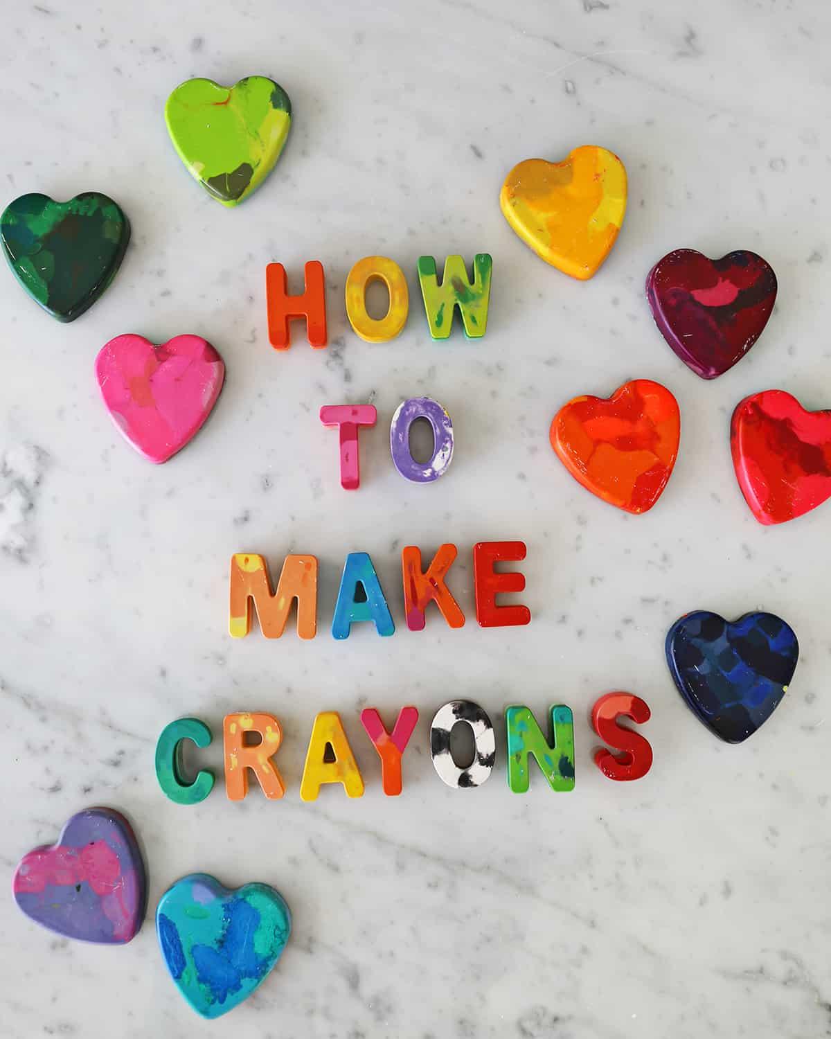 "How to make crayons" written out in homemade crayons and surrounded by homemade heart crayons in various colors