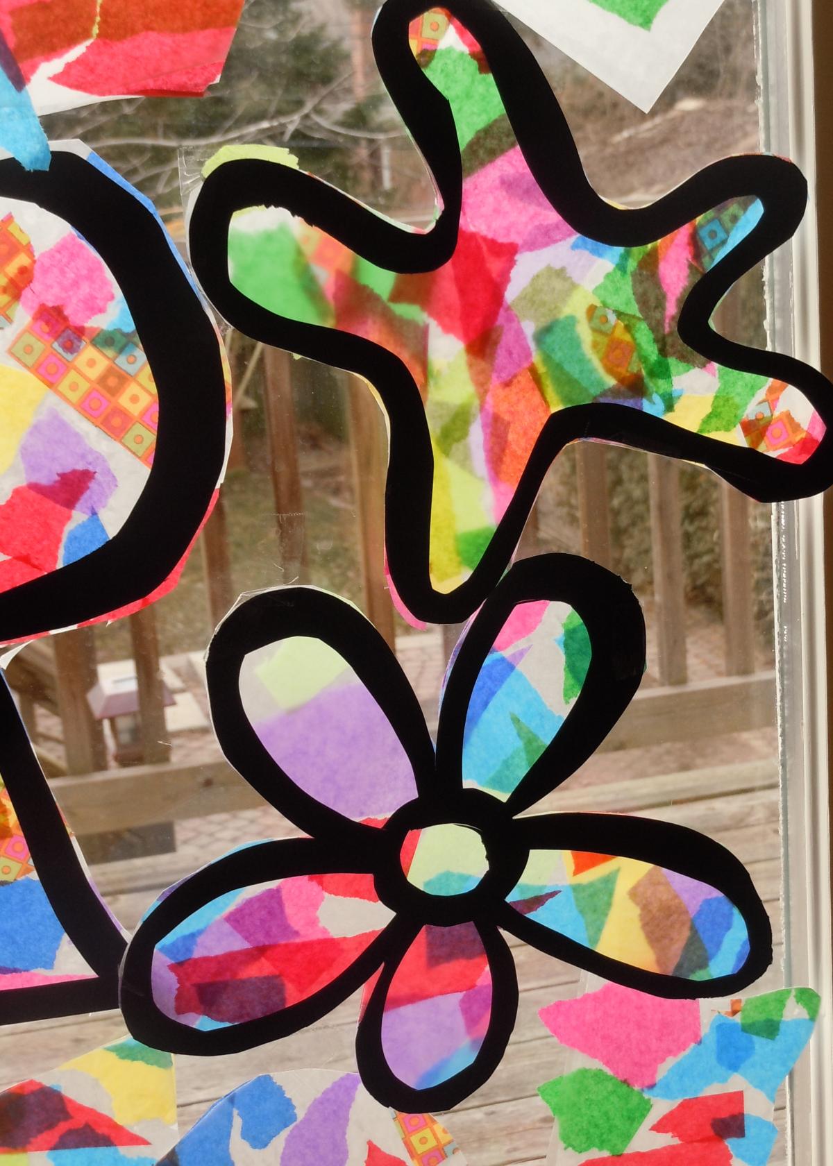 photo of two tissue paper stained glass projects attached to a window