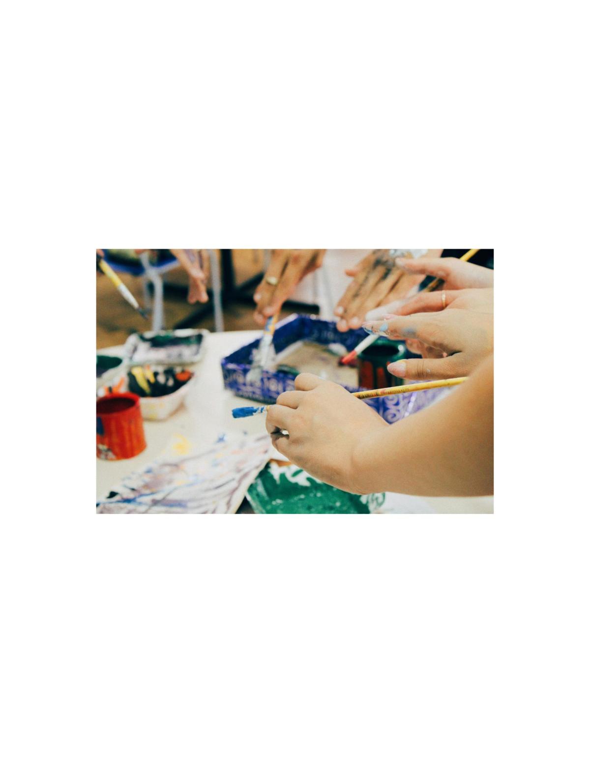 People holding paint burshes.