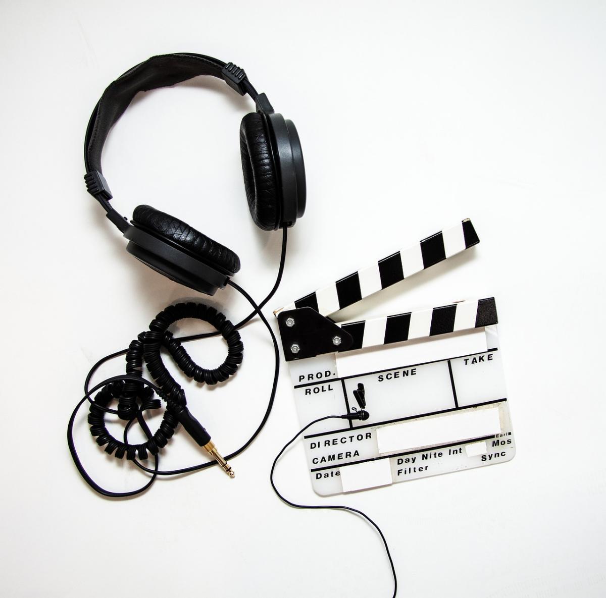 Headphones and clapboard for filmmaking